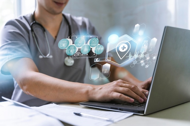 doctor working with laptop on healthcare solution - concept of digital health